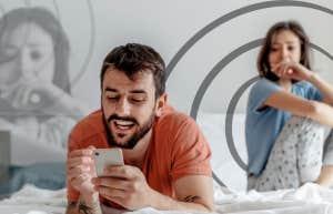 7 Tiny Signs He's Using You (And Is About To Disappear) Man on his phone ignoring his wife