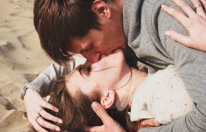 man and woman kissing