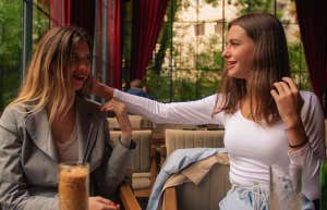 The Conversational Trick That Will Make Anyone Like You In Under A Minute two women having coffee together
