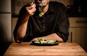 man eating salad