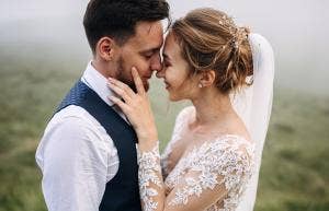 man and woman embracing faces on wedding day