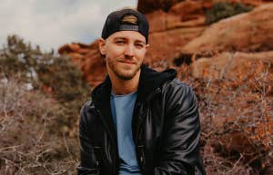 smiling guy in backwards hat