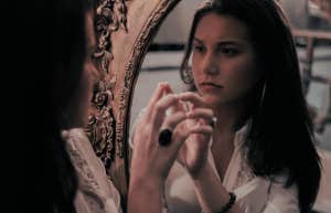 woman looking in a mirror