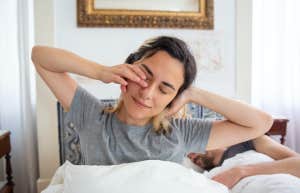 woman waking up in bed