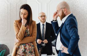 Why Most People Get Divorced In These Two Months, According To Research couple in lawyers office getting a divorce