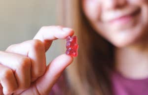 woman holding gummy bear