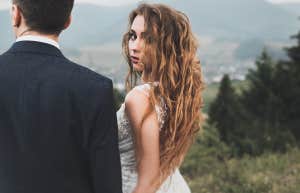 serious woman looking over her shoulder with her partner
