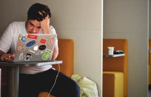 man sitting in front of computer