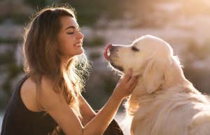 girl petting her dog