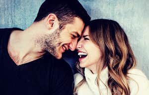 couple laughing heads touching
