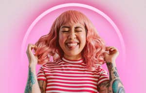 excited woman with pink hair