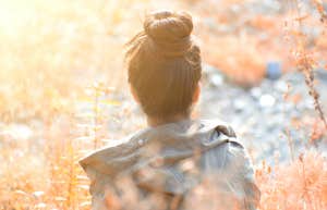 Power Of Suggestion: What It Means & How To Use It woman in flower field