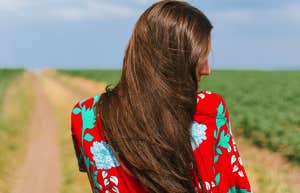 girl walking down country road