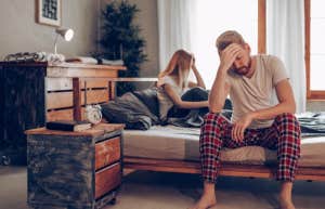 The Harsh Reason Men Think Physical Affairs Are Worse Than Emotional Ones man and woman arguing in bed