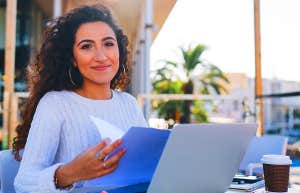 girl working at laptop outside