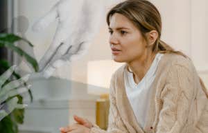 5 Breakup Mistakes That Make Getting Over Him Impossible Woman looking sad