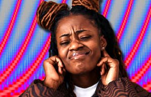 woman holding her ears