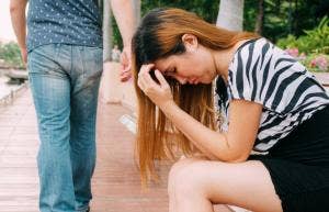 man leaving sad woman