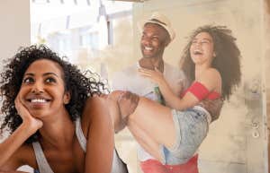Woman day dreaming about her partner being romantic