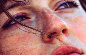 sad woman listening to songs about toxic relationships