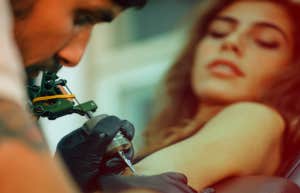 woman getting a tattoo