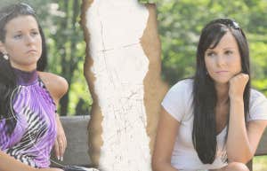 Women sitting on a bench upset