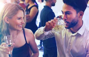 guy and girl at bar drinking