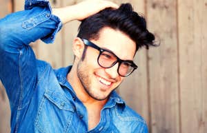smiling man with traits women find attractive