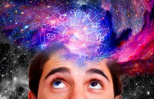Zodiac Signs Most Likely To Fall In Love During The Scorpio Moon On August 21, 2023 man looking up into galaxy