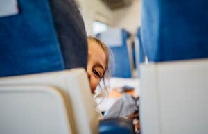 girl reclining her airplane seat
