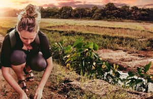 Author collecting the dirt where her uncle died in Hue Vietnam. 