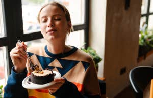 Woman eating what she wants after intermittent fasting