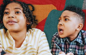 sister and brother arguing over tv remote