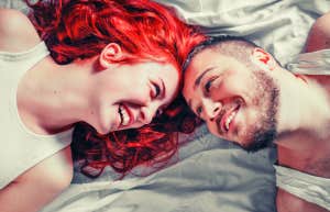 happy couple with their heads next to each other