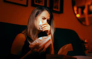 sad woman crying on couch