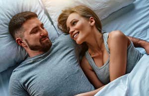 married couple laying in bed