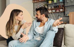 couple arguing with each other while on the couch