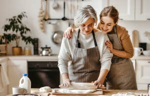 mother-in-law and daughter-in-law daughter cooking in kitchen