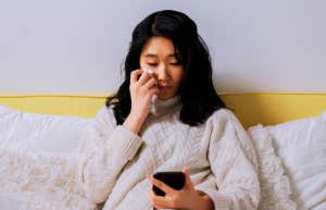 Woman crying on the phone