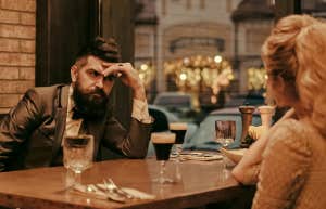 man embarrassed at dinner