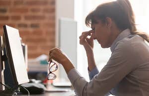 frustrated working woman sitting in front of computer