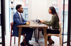 man in suit during job interview with recruiter