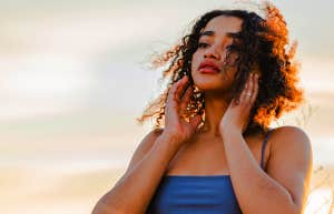 woman standing in sunset