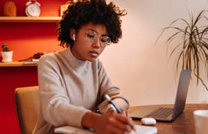 woman writing in journal