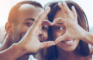 woman and man making heart