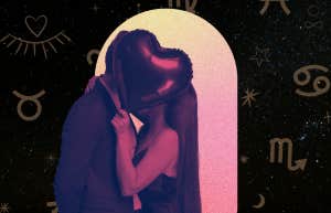 zodiac signs and couple kissing behind heart-shaped balloon