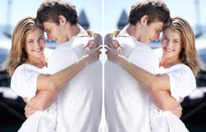 couple in a warm embrace with woman looking at camera