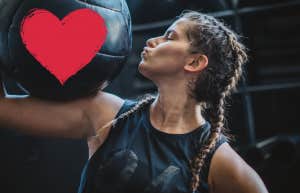 woman kissing a heart