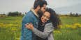 happy couple in a field