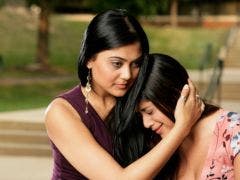 woman comforting crying woman